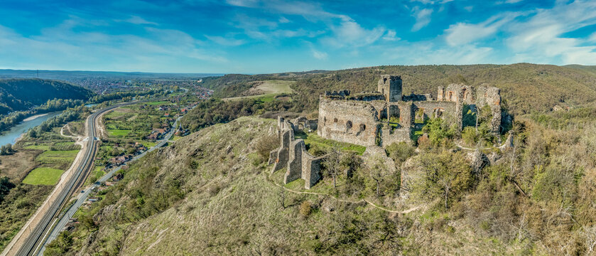 Aerial view of medieval Solymos, Soimos castle ruin in Romania above the Mures river, square keep, gate house, concentric walls near Lipova