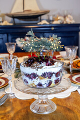 Black Forest Trifle Cake with cherries, whipped cream and shaved chocolate soaked in brandy