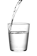 Macro shot of pouring water into a glass design element