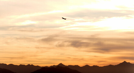 Airplane in the desert sky at golden hour © Gary Franklyn Mosby