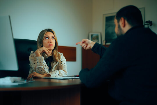 Employee Pointing to his Manager before Quitting Job. Man pointing to a businesswoman blaming her for company mistake 
