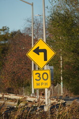 turn left and crossing sign on blue sky