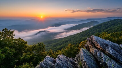 Obraz premium Majestic Mountain Sunrise Over Foggy Valley