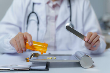 Doctor pouring pills onto a counting tray, meticulously preparing medication for a patient's...