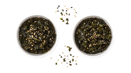 Top and side view of fresh seaweed salad sprinkled with sesame seeds, served in white bowls, isolated on a white background ideal for health-conscious and vegan cuisine.
