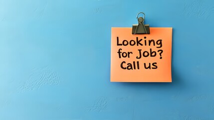 Orange Sticky Note With Looking For Job Call Us Text On A Blue Background, Copy Space
