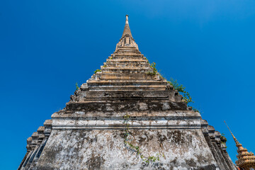 The old pagoda at Wat Klang Khlong Watthanaram, or Wat Muang, in Sena, Ayutthaya, is famed for its vibrant purple ordination hall and intricate decorations, making it a notable landmark in the area.