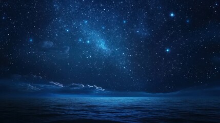 Fototapeta premium A serene night sky filled with stars above a calm ocean.