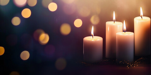 Burning candles illuminating bokeh background creating warm atmosphere