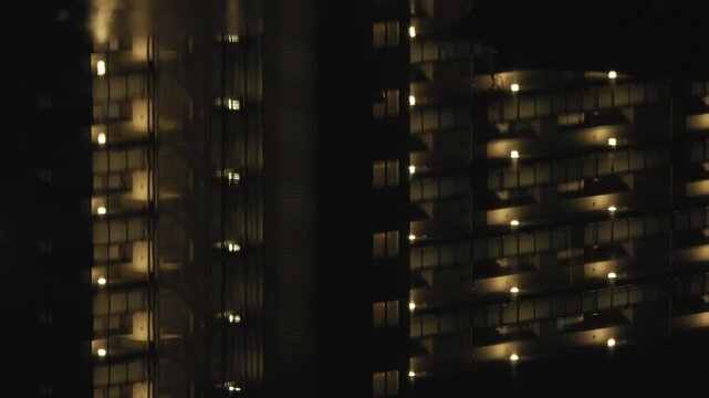 Tokyo,Japan - December 16,  2024: Reflection of condo lights on pond surface
