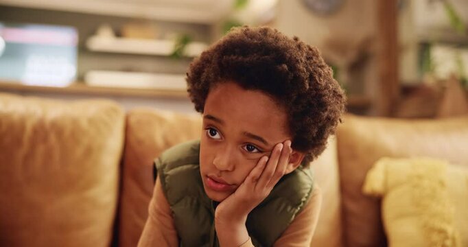 Sad, stress and child thinking of depression, bullying trauma and anxiety for mistake on living room sofa. African kid, home and unhappy boy with mental health crisis, lonely orphan or abuse victim