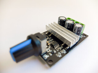 DC Motor speed controller board that regulates motor speed on a white background