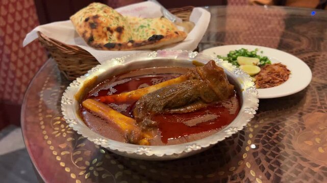 Closeup footage featuring mutton Nalli Nihari prepared in Indian style dipped in oily gravy.
