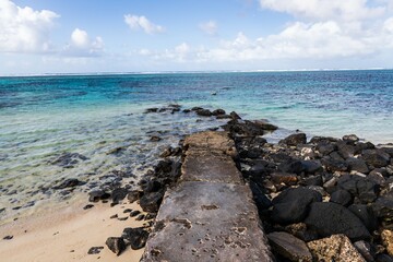 Rocky Shoreline with Clear Blue Ocean and Stone Pathway, Mauritius