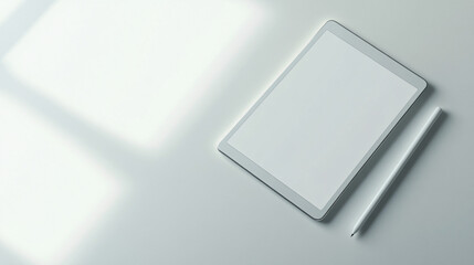 white tablet and stylus on a minimalist white background with shadows