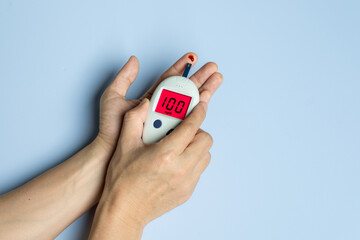 Generated imageTitle	
Woman's hands checking diabetes and hyperglycemia with digital blood sugar meter. Healthcare and medical concept	
