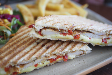 Enjoy delicious grilled sandwiches served with crispy fries, making for an ideal meal
