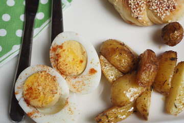 A Delicious Breakfast Plate Featuring Scrambled Eggs and Roasted Potatoes