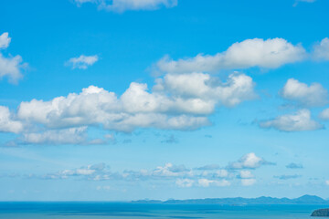 Beautiful clouds in sunny sky over sea nature background