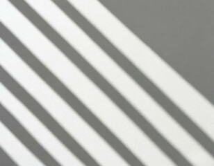 Obraz premium Soft light rays streaming across a smooth white surface, creating a serene and abstract background perfect for design, presentations, or creative projects