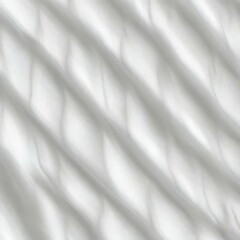Obraz premium Soft light rays streaming across a smooth white surface, creating a serene and abstract background perfect for design, presentations, or creative projects