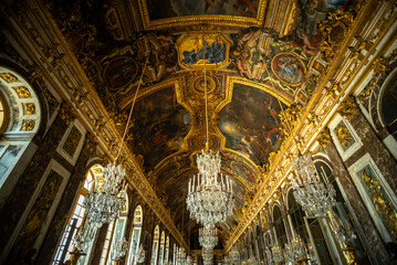 Iconic Ceiling Frescoes and Chandeliers in the Hall of Mirrors of Versailles Palace - Versailles,...