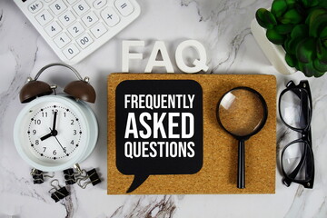 FAQ - Frequently Asked Questions acronym with calculator, alarm clock and magnifying glass,...