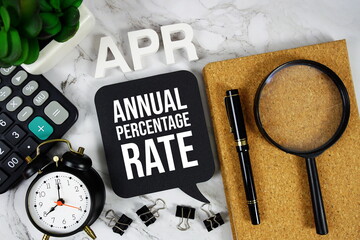 APR - Annual Percentage Rate acronym with calculator, alarm clock and magnifying glass, business...