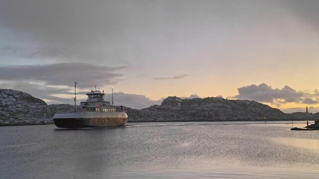 Majestic ferry sails through Svolvaer, Norway at sunrise, peaceful winter scene