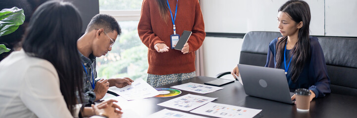 Asian business woman Application Designers presenting trending products report mobile application...