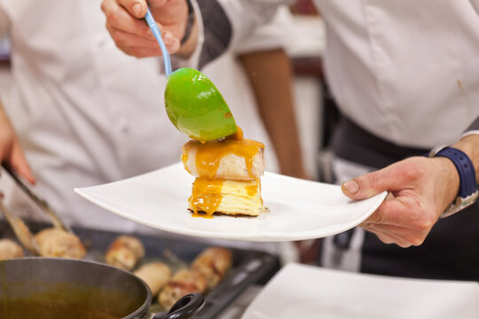 chef at work in restaurant - Powered by Adobe