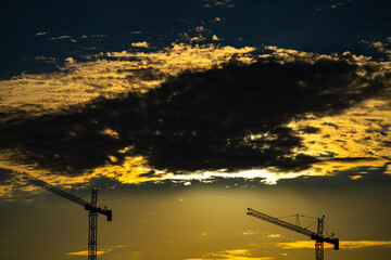 The tower crane. Tower Cranes. Construction of Skyscrapers. Tower Crane on formworks. Crane and building construction. Construction crane on Housing.