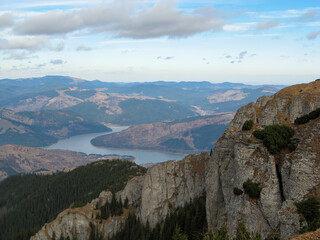 Fototapeta premium Ceahlau Massif and Bicaz Lake with Partly Cloudy Sky in Romania