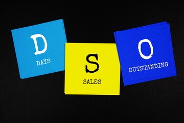 DSO - Days Sales Outstanding acronym text on sticky note on black background
