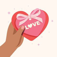 Hand holding pink heart with ribbon for greeting cards, wedding, valentine's day or birthday party. Cute elegant coquette card style.