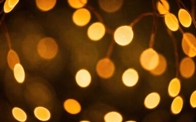 Obraz premium A soft-focus image of warm, glowing bokeh lights creating a cozy atmosphere.