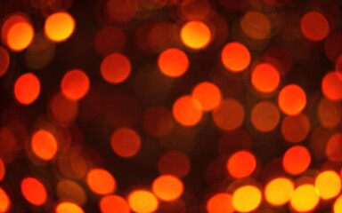 Obraz premium A blurred background of warm orange and red lights creating a festive atmosphere.