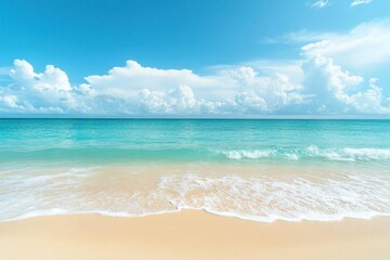 Fototapeta premium Serene beach scene with gentle waves and a clear blue sky.