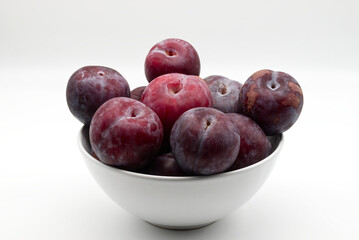 Fresh Plums in a White Bowl,