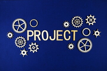 Project alphabet letters with gears element on navy blue background