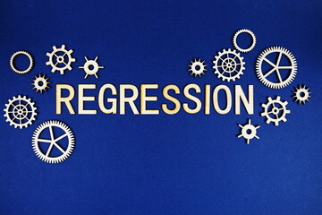 Regression alphabet letters with gears element on navy blue background