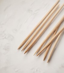 Wooden chopsticks and rests neatly arranged on white background, white, dining