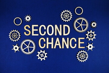 Second Chance alphabet letters with gears element on navy blue background