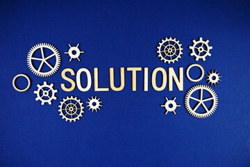 Solution alphabet letters with gears element on navy blue background