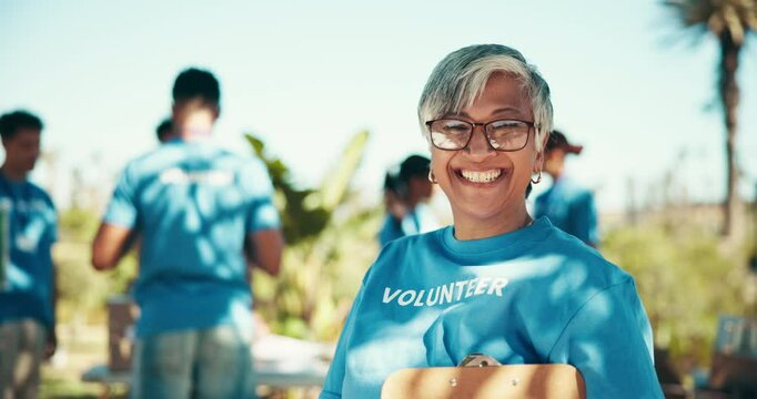 Outdoor, woman and face with clipboard for volunteer, community service and charity with happiness. Park, mature coordinator and portrait with checklist for donation information, ngo and team leader