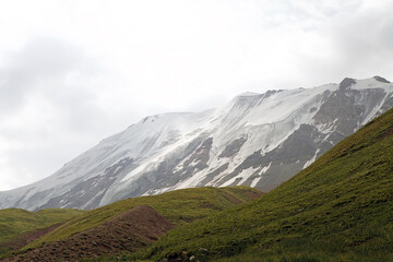 Glacier in the mountains at the foot of Lenin Peak in the Pamir Mountains in Kyrgyzstan