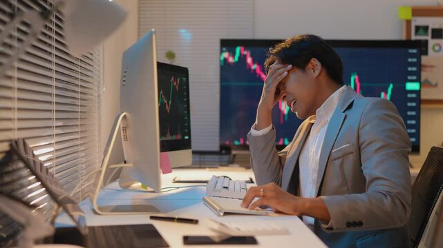 Asian businessman stressed from financial loss, business investment, stock market, online marketing, failed investment concept, economic crisis, loss, failed plan.