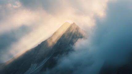 Serene mountain peaks enveloped in mist nature photography cloudy atmosphere aerial perspective tranquil beauty