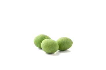 Pile of whole  wasabi coated peanuts isolated on white.