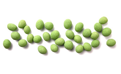 Pile of whole  wasabi coated peanuts isolated on white.